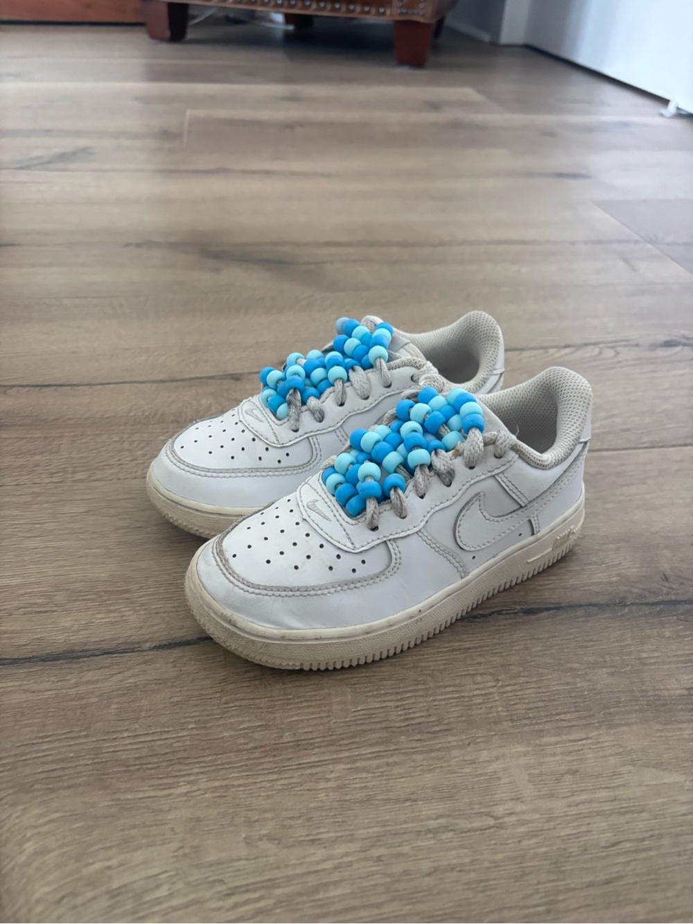 Nike Air Force 1 - Kids White Sneakers with Blue Beaded Lace.